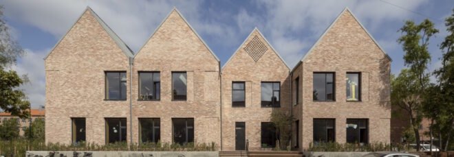 brick school building with multiple gables