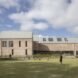 side of long brick school building