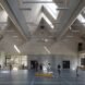kids in gymnasium with pitched ceilings and skylights