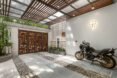 motorcycle parked in white covered garage area