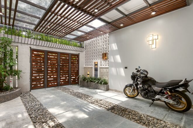 motorcycle parked in white covered garage area