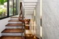 marble panels covering glass wall beside a staircase