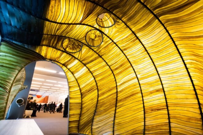 curving pavilion walls made of kelp
