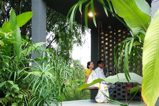 two people seating on outdoor balcony