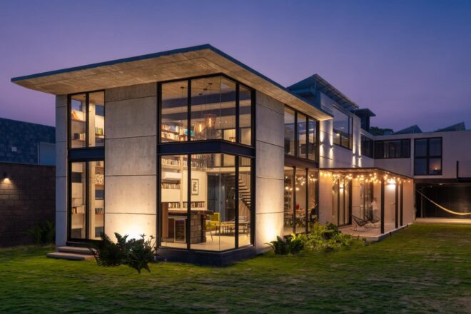 corner shot of home with large walls of glass