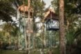 two treehouse structures with winding staircases