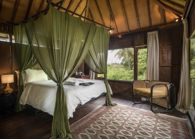 large white bed with mosquito netting