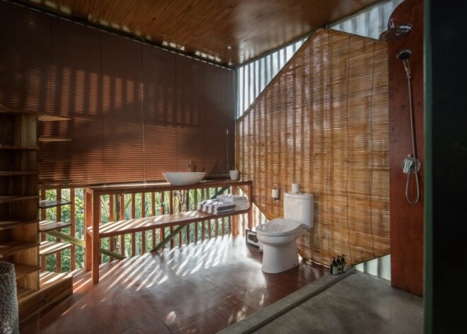 room with a toilet surrounded by bamboo panels