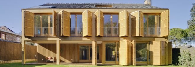 tan home with wood shutters
