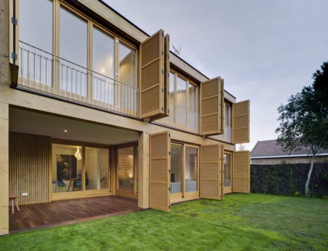 tan home with open wood shutters