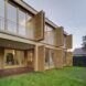 tan home with open wood shutters