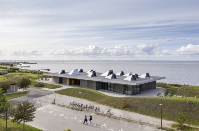 long, one-story gray building near the sea