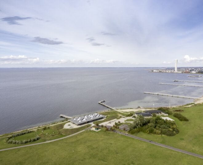 aerial view of long gray building near the sea
