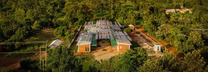 tan brick building covered in solar panels