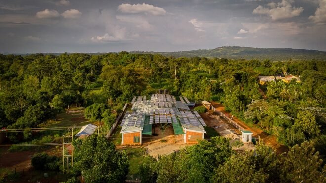 tan brick building covered in solar panels