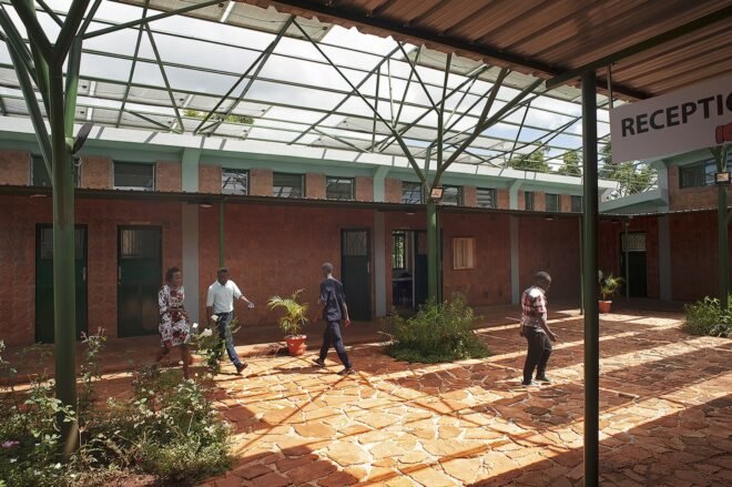 people walking in stone courtyard