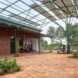 stone courtyard covered with a solar panel roof