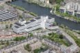 a bird's-eye view of the old Rivierstaete building, showing the city, trees and river