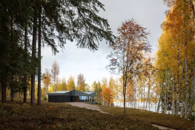 dark home with angular roof on natural landscape