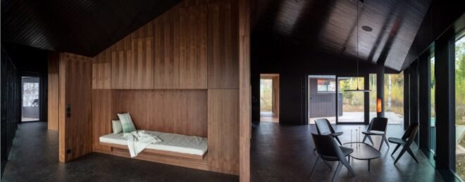 a built-in sofa bed in a wooden wall
