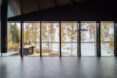 an interior space lined with large windows