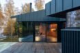 a wooden deck surrounded by glass doors