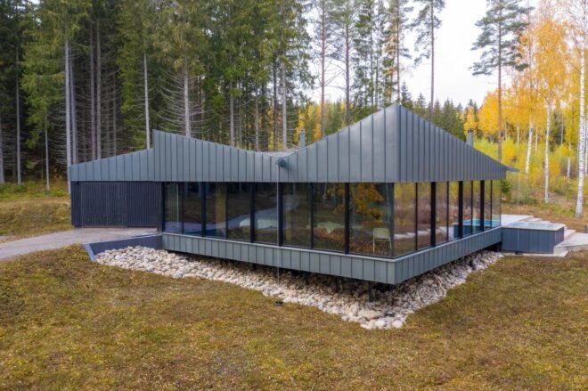 a dark home with angular roof