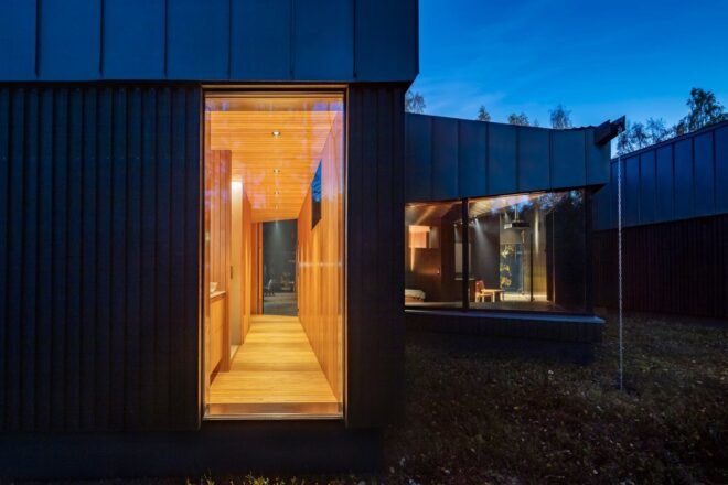 vertical window revealing hallway inside a dark home