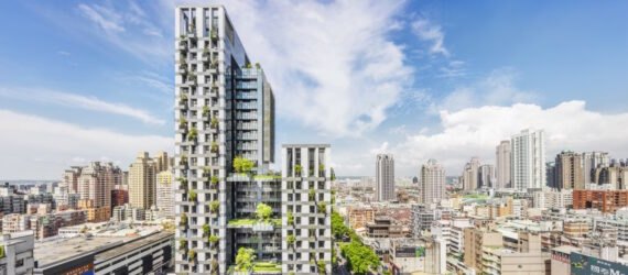 rendering of white tower covered in plants in a city