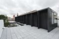 extended black structure with outdoor space
