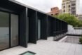 black structure with open doors leading to interior space