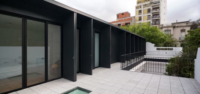 black structure with open doors leading to interior space