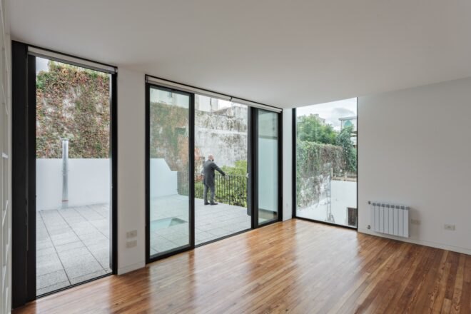 white interior with large windows and glass doors