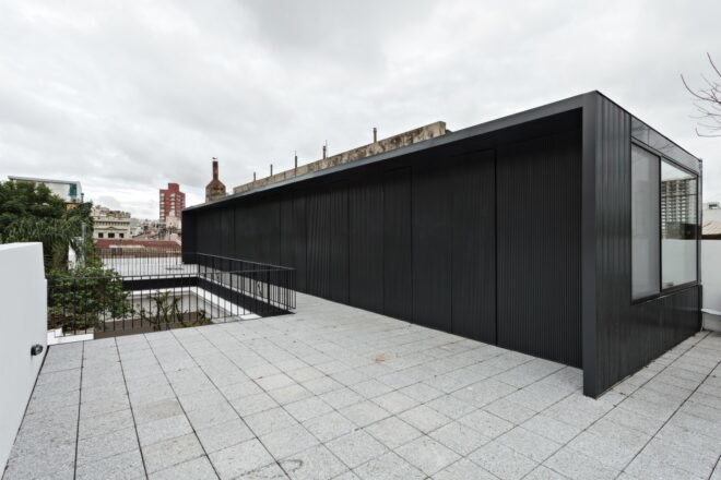 elongated structure with black cladding