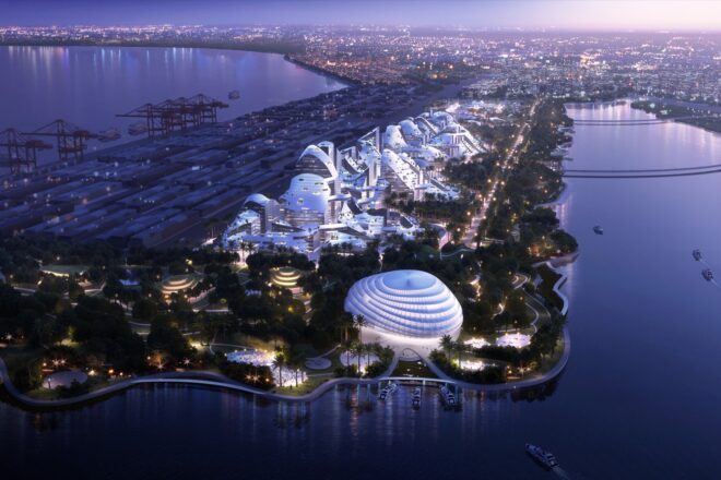 a night view of a birdseye view of a smart city on an island surrounded by water