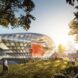 a tear-drop shaped building surrounded by greenery