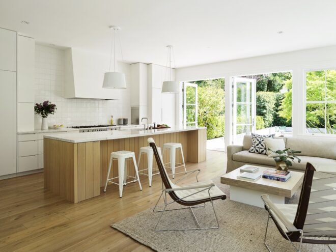 beige sofa and two chairs near wooden kitchen island