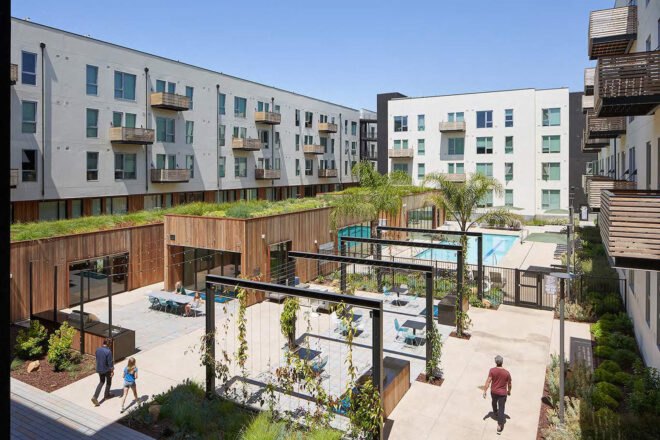 the middle of the housing community, featureing a pool and standing plant-growth structures