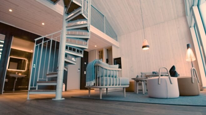 an interior living space with spiral staircase
