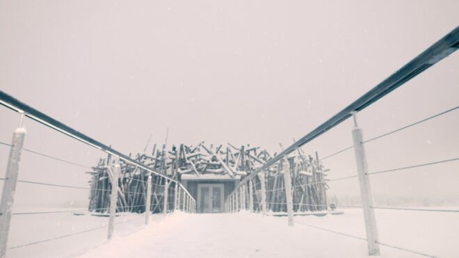 walkway leading up to nest-like building