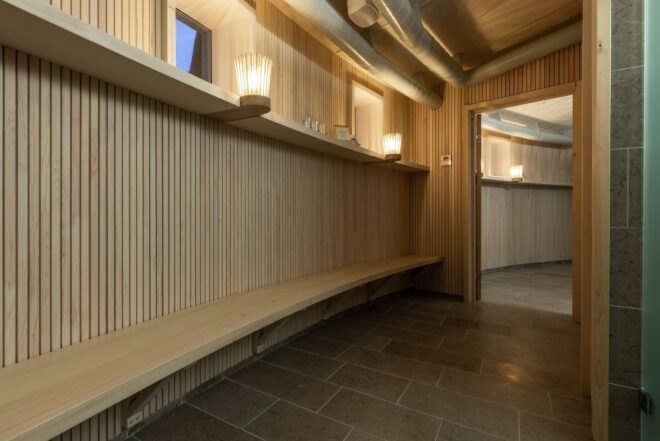 a circular sauna space with bench seating