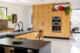 kitchen with wood cabinets and black countertops