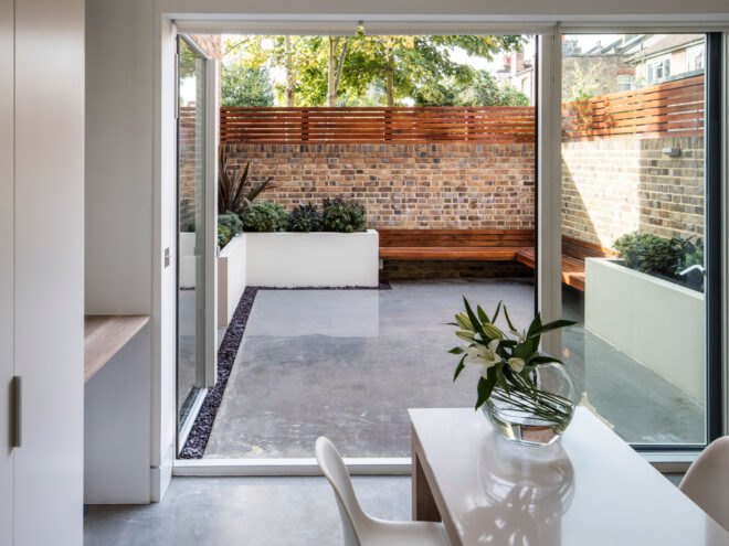 white dining table near open glass door