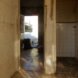 before image of old home with cracked tile walls