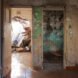 before image of old home with peeling green wallpaper