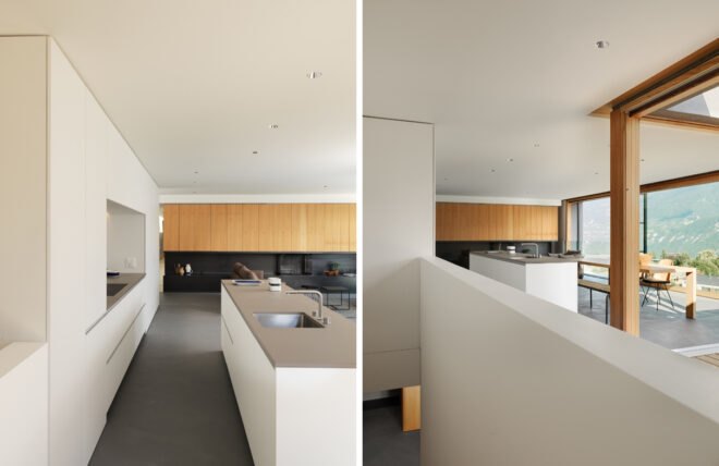 open-plan kitchen and living area with white cabinets and large windows