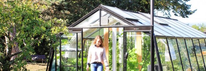 person leaving a greenhouse
