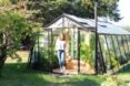 person leaving a greenhouse