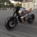 angled view of gray and orange hybrid motorcycle