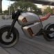 side view of gray and orange hybrid motorcycle